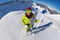 View of woman in mask standing and holding ski Royalty Free Stock Photo