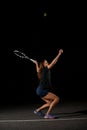 view on woman with racket in special pose which preparing to hit ball above her head Royalty Free Stock Photo