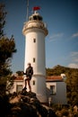 view woman standing on stone against the background of the Gelidonya lighthouse