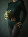 View of a woman torso holding a flower Royalty Free Stock Photo