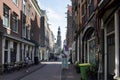 View of woman walking on street in Jordaan neighborhood