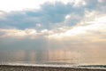 View of wonderful sky with majestic clouds and sun beams and sea. Seascape on dawn. Royalty Free Stock Photo