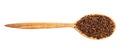 View of wood spoon with canihua grains isolated