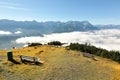 View of a wooden bench facing the beautiful panorama of Mountain Zugspitze Royalty Free Stock Photo
