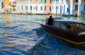 View of wooden boat taxi at venice grand canal spring time Royalty Free Stock Photo