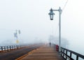 View of the wooden bridge in foggy weather, Santa Barbara, California, USA. Copy space for text Royalty Free Stock Photo