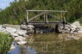 Wooden bridge over mointain river. Pirin Mountain, Bulgaria Royalty Free Stock Photo