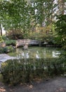 A view of a wooden bridge over a pond at a Japanese Garden Royalty Free Stock Photo