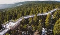 View of wooden bridge treetop Pohorje observation deck in winter