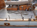 Wooden deck of an old yacht and ropes