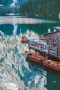 view of wooden dock boats station at braies lake in Italy Royalty Free Stock Photo