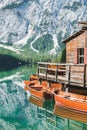 view of wooden dock boats station at braies lake in Italy Royalty Free Stock Photo