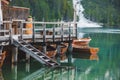 view of wooden dock boats station at braies lake in Italy Royalty Free Stock Photo