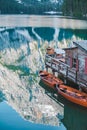 view of wooden dock boats station at braies lake in Italy Royalty Free Stock Photo