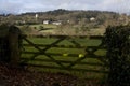 View through wooden gate of church in distance Dar