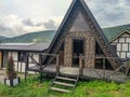 View of the wooden houses for the rest of tourists in the Caucasus mountains. Prielbrusye National Park, Kabardino-Balkaria, Royalty Free Stock Photo