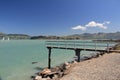 View of wooden jetty with sailing activity on weeked in Lyttelton Harbour in South Island, New Zealand Royalty Free Stock Photo