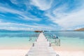 View of the wooden pier from the coast of Kanawa Island