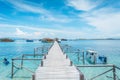 View of the wooden pier from the coast of Kanawa Island