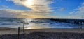 View of a wooden pier at Henley Beach in Australia with a cloudy blue sky in the background Royalty Free Stock Photo