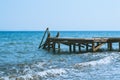 View of a wooden pier and seascape with running waves Royalty Free Stock Photo