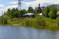 View of the wooden `Temple in the Name of All Saints in the Land of Siberian Shed` from the university