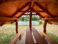 View through wooden tourist shelter to pond level