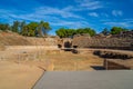 View from the wooden walkway of the arena of the Roman Amphitheater of Merida illuminated by the light of dawn creating shadows Royalty Free Stock Photo