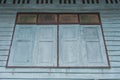 View of wooden window on vintage wall of old wooden house at countryside. Royalty Free Stock Photo