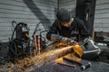 View of worker grinding a piece of metal, Poncin Metal industry, France