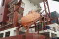 Close view at a container ship with rescue boat Royalty Free Stock Photo