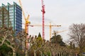 View on the working construction cranes in the financial district of Frankfurt am Main city