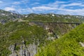 A view of a wrecked bridge over a ravine from a train on the White Pass and Yukon railway near Skagway, Alaska