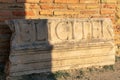 View of the writing on the walls of the famous Roman ruins in Timgad, Algeria