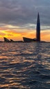 View from the yacht of the Gulf of Finland and the Lakhta Center skyscraper on the background of a pink sunset, the