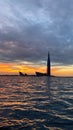 View from the yacht of the Gulf of Finland and the Lakhta Center skyscraper on the background of a pink sunset, the