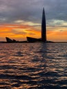 View from the yacht of the Gulf of Finland and the Lakhta Center skyscraper on the background of a pink sunset, the