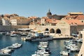 View of the yacht harbour in the old town port of Dubrovnik, with the dome tower of the Cathedral