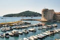 View of the yacht harbour in the old town port of Dubrovnik, with the island of Lokrum visible in the distance