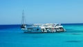 Yacht parking with tourists near White Island in Red sea. Royalty Free Stock Photo