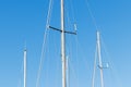 View of yacht topmast on a clear blue sky Royalty Free Stock Photo