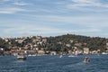 View of yachts and cruise tour boats on Bosphorus and Bebek neighborhood on European side of Istanbul.