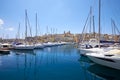 The view of yachts moored in harbor in Dockyard creek with Senglea peninsular on background. Malta