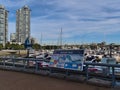 View of Yaletown Dock with marina, buildings and information board of Aquabus that offers connections in False Creek. Royalty Free Stock Photo