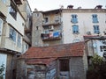 view on yard at old rental houses in corte city corsica with balcony and hanging clothes Royalty Free Stock Photo