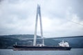 Yavuz Sultan Selim Bridge and container ship Istanbul, Turkey Royalty Free Stock Photo