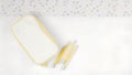 View of yellow pencil case with pencils on a white surface and polka dots Royalty Free Stock Photo