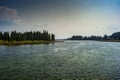 View of Yellowstone River with smoky sky from the Fishing Bridge in Yellowstone Royalty Free Stock Photo