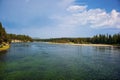 View of Yellowstone River with smoky sky from the Fishing Bridge in Yellowstone Royalty Free Stock Photo