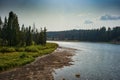 View of Yellowstone River with smoky sky from the Fishing Bridge in Yellowstone Royalty Free Stock Photo